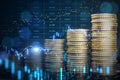 Abstract image of growing coin stacks and candlestick forex chart on blurry backdrop. Trade, money and financial growth concept. Royalty Free Stock Photo