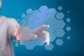 Abstract image of a hand interacting with a digital hexagon network. Perfect for technology, innovation, and connection concepts Royalty Free Stock Photo