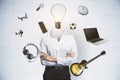 Abstract image of headless businesswoman with idea head, laptop, guitar and other items flying around on concrete wall background