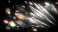 Abstract image of iridescent crystal shards floating against a dark background, creating a dynamic and colorful visual effect. Royalty Free Stock Photo