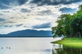 Abstract image of lake with mountain and dark cloud Royalty Free Stock Photo