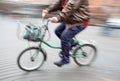 Abstract image of a large man on a little bike