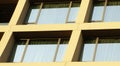 Abstract image of looking up at modern glass and concrete building. Architectural exterior detail of office building