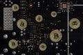 Abstract image Obverse of crypto currency bitcoin on the background of computer`s electronic circuit board. Royalty Free Stock Photo