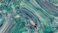 Abstract image of ocean wave in hues of gree, aqua, pink, and blue