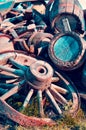 Abstract image with old wooden barrels of alcohol and wheels from the cart