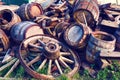 Abstract image with old wooden barrels of alcohol and wheels from the cart