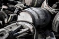 Abstract image with old wooden barrels of alcohol and wheels from the cart