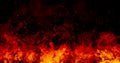 Orange fire or flames with sparkles and smoke in black background. Royalty Free Stock Photo