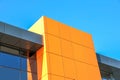 abstract image orange metal wall against the blue sky