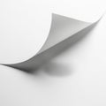 An abstract image showcasing a curled edge of a white sheet of paper against a plain Royalty Free Stock Photo