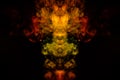 Abstract image of smoke of different green, yellow, orange and red colors in the form of horror in the shape of the head, face and Royalty Free Stock Photo