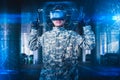 The abstract image of the soldier use a VR glasses for combat simulation training overlay with the hologram. the concept of virtua Royalty Free Stock Photo