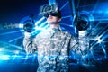 The abstract image of the soldier use a VR glasses for combat simulation training overlay with the hologram.
