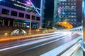 Abstract image of street traffic in Hong Kong at night. Office skyscraper buildings with blurred car light trails. Hong Kong, Royalty Free Stock Photo