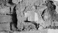 Abstract image of an very old wall, broken plaster with old, partly broken bricks inside Royalty Free Stock Photo