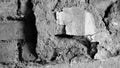 Abstract image of an very old wall, broken plaster with old, partly broken bricks inside, aged with long time Royalty Free Stock Photo