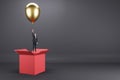 Abstract image of young european businessman flying on golden balloon out of red paper box on light background with mock up place