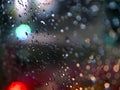 Abstract Images Rain Drops On The Mirror At Night. Take Real Focus Bokeh