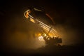 Abstract Industrial background with construction crane silhouette over amazing night sky with fog and backlight. Tower crane Royalty Free Stock Photo