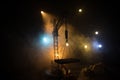 Abstract Industrial background with construction crane silhouette over amazing night sky with fog and backlight. Tower crane Royalty Free Stock Photo