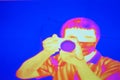 Abstract infrared thermography image showing the heat emission when man used a camera. Thermal scanner.