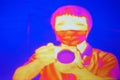 Abstract infrared thermography image showing the heat emission when man used a camera. Thermal scanner.