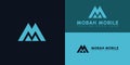 Abstract initial triangle letter M or MM logo in blue cyan color isolated on multiple blue background colors Royalty Free Stock Photo