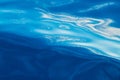 Abstract water background. Calm ocean water surface with curled white reflections Royalty Free Stock Photo