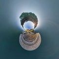 Abstract inversion of little planet transformation of spherical panorama 360 degrees. Spherical abstract aerial view on wooden