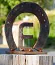 Iron horseshoe with the letter E Royalty Free Stock Photo