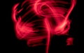 Abstract irregular red light on black background. Long exposure. Light painting photography Royalty Free Stock Photo