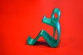 Abstract isolated object of a green color printed on a 3d printer on red surface Royalty Free Stock Photo