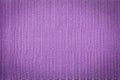 Abstract lavender colored mesh fabric background with vignette top view, macro photography