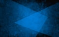 Abstract layers of blue triangles on textured black background in elegant geometric design
