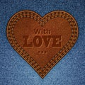 Abstract leather heart on jeans texture