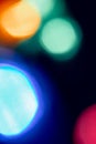 Abstract lens flare on black background. blue, red, orange, green defocused bokeh lights. glowing color burst. festive christmas Royalty Free Stock Photo