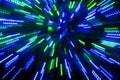 Abstract lens zoom flare, concept image of space, speed, technology, or time travel background over dark colors and bright lights. Royalty Free Stock Photo