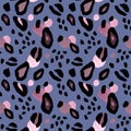 Abstract leopard or cheetah coat print. Artistic animal skin seamless pattern on blue background. Pink and black spots Royalty Free Stock Photo