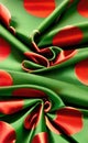 Green and red silk fabric background. Close up of ripples in green silk fabric. A red and green silk texture. Royalty Free Stock Photo