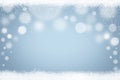 Abstract light blue Winter bokeh snowflakes and snow background