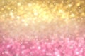 Abstract light golden gradient pink festive bokeh background with glitter sparkle blurred circles, Christmas lights. Beautiful Royalty Free Stock Photo