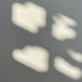 Abstract light patterns create soft, blurred shapes on a gray background. The shapes Royalty Free Stock Photo