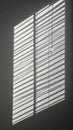 Abstract Light and Shadow Patterns of Window Blinds on Wall in Monochrome Royalty Free Stock Photo