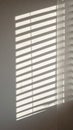 Abstract Light and Shadow Through White Window Blinds Royalty Free Stock Photo
