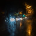 Abstract lights blue, yellow and white color on a black background. night view city in the rain Royalty Free Stock Photo