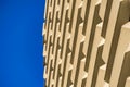 Abstract line pattern of architecture geometric background. Details of balcony building against blue sky