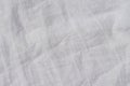 Abstract linen fabric background. Crumpled natural flaxen material fabric. Top view, copy space