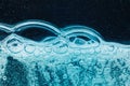 Abstract liquid soap bubbles blue background Royalty Free Stock Photo