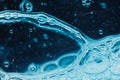 Abstract liquid soap bubbles blue background Royalty Free Stock Photo